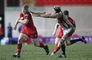 5 March 2010; Jon Davies, Llanelli Scarlets, gets away from Dan Tuohy, Ulster. Celtic League, Llanelli Scarlets v Ulster, Parc Y Scarlets, Llanelli, Wales. Picture credit: Steve Pope / SPORTSFILE