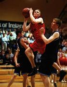 3 May 2001; Fergus Kelly of Cnoc Mhuire in action against Neil Lydon and Liam Staunton of St Gerald's College during the Cadbury's TimeOut All-Ireland Under 19 'B' Schoolboys Final match between Cnoc Mhuire Granard, Longford, and St Gerard's Castlebar, Mayo, at the National Basktetball Arena in Tallaght, Dublin. Photo by Brendan Moran/Sportsfile