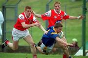 6 May 2001; Ciaran Drake of Longford in action against Ollie McDonnell, left, and JP Rooney during the Bank of Ireland Leinster Senior Football Championship First Round match between Louth and Longford at Páirc Tailteann in Navan, Meath. Photo by Damien Eagers/Sportsfile