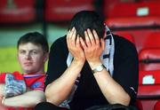 6 May 2001; A dejected Shelbourne fan sits in the stand after the Eircom League Premier Division match between Shelbourne and Cork City at Tolka Park in Dublin. Photo by David Maher/Sportsfile