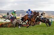 16 March 2016; Diego Du Charmil, with Sam Twiston-Davies up, on their way to winning the Fred Winter Juvenile Handicap Hurdle as Campeador, with Barry Geraghty up, left, and Voix Du Reve, with Ruby Walsh up, right, fall at the last. Also pictured Coo Star Sivola, with Lizzie Kelly up, back centre. Prestbury Park, Cheltenham, Gloucestershire, England. Picture credit: Cody Glenn / SPORTSFILE