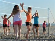 16 March 2016; Caroline O'Hanlon, centre, Armagh, celebrates with team-mates Annie Walsh, left, Cork, and Aimee Mackin, Armagh, while playing volleyball during beachside activities on Coronado Beach on Coronado Island. TG4 Ladies Football All-Star Tour. San Diego, California, USA. Picture credit: Brendan Moran / SPORTSFILE