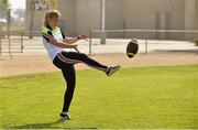 17 March 2016; TG4 LGFA All Star Sinead Kernan, Armagh, kicks an American Football during a demonstration of Ladies Football to students from Mar Vista High School. TG4 Ladies Football All-Star Tour, Mar Vista High School, Imperial Beach. California, USA. Picture credit: Brendan Moran / SPORTSFILE