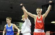 6 March 2010; Gary Molloy, Moate, is announced victorious, by referee Sadie Duffy, over Conor Ahern, Baldoyle, following their men's elite 51kg final bout. Men's Elite & Women's Novice National Championships 2010 Finals - Saturday Evening Session, National Stadium, Dublin. Picture credit: Stephen McCarthy / SPORTSFILE