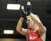 6 March 2010; Eric Donovan, St Michaels Athy, is victorious over David Oliver Joyce, St Michaels Athy, following their men's elite 60kg final bout. Men's Elite & Women's Novice National Championships 2010 Finals - Saturday Evening Session, National Stadium, Dublin. Picture credit: Stephen McCarthy / SPORTSFILE