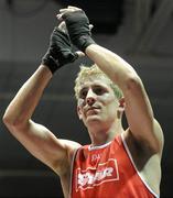 6 March 2010; Eric Donovan, St Michaels Athy, is victorious over David Oliver Joyce, St Michaels Athy, following their men's elite 60kg final bout. Men's Elite & Women's Novice National Championships 2010 Finals - Saturday Evening Session, National Stadium, Dublin. Picture credit: Stephen McCarthy / SPORTSFILE