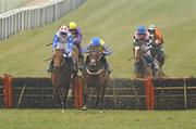 17 March 2010; Peddlers Cross, with Jason Maguire up, blue, yellow and grey silks, jumps the last ahead of second place Reve de Sivola, with Daryl Jacob up, left, and third place Rite of Passage, with Robbie McNamara up, purple and yellow silks, on their way to wiinning the Neptune Investment Management Novices' Hurdle. Cheltenham Racing Festival - Wednesday. Prestbury Park, Cheltenham, Gloucestershire, England. Picture credit: Stephen McCarthy / SPORTSFILE