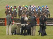 17 March 2010; Runners and riders approach the last hurdle, first time around, during the Neptune Investment Management Novices' Hurdle. Cheltenham Racing Festival - Wednesday. Prestbury Park, Cheltenham, Gloucestershire, England. Picture credit: Stephen McCarthy / SPORTSFILE