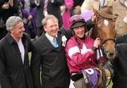 17 March 2010; Michael O'Leary, left, member of the winning connections of Weapon's Amnesty with trainer Charles Byrnes and jockey Davey Russell after winning the RSA Chase. Cheltenham Racing Festival - Wednesday. Prestbury Park, Cheltenham, Gloucestershire, England. Photo by Sportsfile