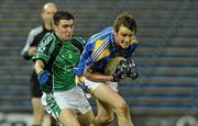 18 March 2010; Conor Sweeney, Tipperary, in action against Damien Quaid, Limerick. Cadbury Munster GAA Football Under 21 Championship Semi-Final, Tipperary v Limerick, Semple Stadium, Thurles, Co. Tipperary. Picture credit: Diarmuid Greene / SPORTSFILE