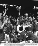 5 September 1976; Cork captain Ray Cummins lifts the Liam MacCarthy Cup after his side's victory over Wexford. Also pictured are GAA President Con Murphy, right, and Cork players, from left, Pat McDonnell, John Horgan, Martin O'Doherty, Martin Coleman, goalkeeper, Charlie McCarthy, 13, Denis Coughlan, 7, Gerald McCarthy and Brian Murphy. All Ireland Senior Hurling Championship Final, Cork v Wexford, Croke Park, Dublin. Picture credit; Connolly Collection / SPORTSFILE