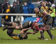 3 April 2016; John Jenkinson, Wicklow, is tackled by Colm Quinn, left, and Alaric Collier, Clondalkin. Bank of Ireland Provincial Towns Cup Semi-Final, Wicklow v Clondalkin. Co. Carlow Football Club, Oakpark, Carlow. Photo by Sportsfile