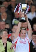 11 April 2010; The Tyrone captain Sinead O'Neill, in the company of the Camogie Association president Joan O'Flynn, lifts the cup. Camogie National League Division 4 Final, Tyrone v Westmeath, Healy Park, Omagh, Co. Tyrone. Picture credit: Ray McManus / SPORTSFILE