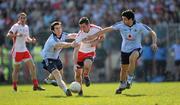 11 April 2010; Philip Jordan, Tyrone, in action against Michael Daragh McAuley, left, and Cian O'Sullivan, Dublin. Allianz GAA Football National League Division 1 Round 7, Tyrone v Dublin, Healy Park, Omagh, Co. Tyrone. Picture credit: Ray McManus / SPORTSFILE