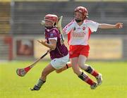 11 April 2010; Denise McGrath, Westmeath, in action against Aisling Corr, Tyrone. Camogie National League Division 4 Final, Tyrone v Westmeath, Healy Park, Omagh, Co. Tyrone. Picture credit: Ray McManus / SPORTSFILE