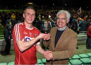 7 April 2016; Sean White, Cork, is presented with the EirGrid Man of the Match award by John O'Connor from EirGrid. EirGrid Munster GAA Football U21 Championship Final, Kerry v Cork. Austin Stack Park, Tralee, Co Kerry. Picture credit: Diarmuid Greene / SPORTSFILE