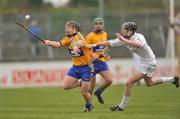 18 April 2010; Johnathan Clancy, Clare, in action against Neil O' Muineachain, Kildare. Allianz GAA Hurling National League, Division 2, Round 7, Kildare v Clare, St Conleth's Park, Newbridge, Co. Kildare. Picture credit: Barry Cregg / SPORTSFILE