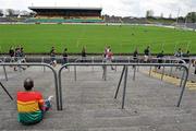 18 April 2010; A lone Carlow fan watches as the Carlow hurlers make their way in from the warm up. Allianz GAA Hurling National League, Division 2, Round 7, Carlow v Laois, Dr Cullen Park, Carlow. Picture credit: Brian Lawless / SPORTSFILE