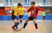 19 April 2010; Darren Soon, DIT, in action against Aldo Xhani, UCC. National Colleges and Universities Futsal Cup Semi-Final 1, DIT v UCC, University of Limerick, Limerick. Picture credit: Diarmuid Greene / SPORTSFILE