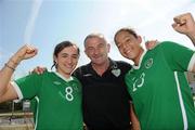 22 April 2010; The Republic of Ireland team arrived home after qualifying for the European Women's U17 Championships Semi-Finals. The team were due to arrive home on Saturday 18th April but were delayed in Istanbul due to the disruption to air travel. Manager Noel King with his captain Dora Gorman, from Salthill, Galway, left, and Rianna Jarrett, from Wexford Town, celebrate on arrival. Dublin Airport, Dublin. Picture credit: Brian Lawless / SPORTSFILE