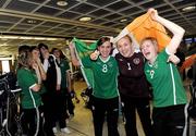 22 April 2010; The Republic of Ireland team arrived home after qualifying for the European Women's U17 Championships Semi-Finals. The team were due to arrive home on Saturday 18th April but were delayed in Istanbul due to the disruption to air travel. Players, from left, Dora Gorman, from Salthill, Galway, Grace Moloney, Reading, and Denise O'Sullivan, from Wilton, Cork, celebrate on arrival. Dublin Airport, Dublin. Picture credit: Brian Lawless / SPORTSFILE