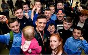 18 April 2016; Team Ireland's Brendan Irvine who won a Bronze medal at the European Olympic Boxing Qualifiers in Samsun, Turkey, holding his niece Sophia Muldoon, age 1, and surrounded by supporters on his return home. Dublin Airport, Dublin. Picture credit: Cody Glenn / SPORTSFILE
