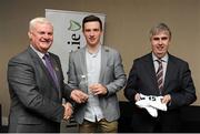 18 April 2016; Shane Carey, DCU, from Monaghan, is presented with his Independent.ie Football Rising Stars Award award by Uachtarán Chumann Lúthchleas Gael Aogán Ó Fearghail, left, and Gerry Tully, Chairman of Comhairle Ardoideachais, right. Independent.ie Football Rising Stars Awards. Croke Park, Dublin. Picture credit: Seb Daly / SPORTSFILE