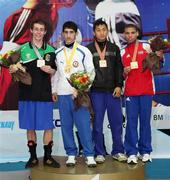 3 May 2010; Ryan Burnett, Ireland, left, shows off his silver medal at the 2010 AIBA Youth World Championships with gold medal winner Salman Alizada, Azerbaijan, second left, and bronze medalists Zohidjon Hoorboyev, Uzbekistan, third left, and Yosvany Veita Soto, Cuba. AIBA Youth World Championships, Baku, Azerbeijan. Picture syndicated by SPORTSFILE on behalf of the AIBA