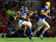 3 June 2001; John Leahy of Tipperary races clear of Gerry Quinn of Clare during the Guinness Munster Senior Hurling Championship Semi-Final match between Tipperary and Clare at Páirc Uí Chaoimh in Cork. Photo by Ray McManus/Sportsfile