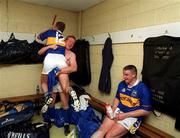 3 June 2001; Tipperary players Brian O'Meara, 12, celebrates with Declan Ryan as John Carroll, right, looks on following the Guinness Munster Senior Hurling Championship Semi-Final match between Tipperary and Clare at Páirc Uí Chaoimh in Cork. Photo by Ray McManus/Sportsfile