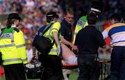 3 June 2001; Tipperary manager Nicky English watches as John Leahy of Tipperary is taken off the field on a stretcher with a knee injury during the Guinness Munster Senior Hurling Championship Semi-Final match between Tipperary and Clare at Páirc Uí Chaoimh in Cork. Photo by Ray McManus/Sportsfile