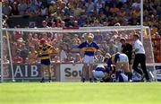 3 June 2001; John Leahy, 20, of Tipperary receives attention from his team-mates after suffering from a knee injury during the Guinness Munster Senior Hurling Championship Semi-Final match between Tipperary and Clare at Páirc Uí Chaoimh in Cork. Photo by Brendan Moran/Sportsfile