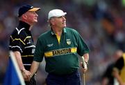 10 June 2001; Offaly manager Michael Bond, right and Kilkenny manager Brian Cody shake hands, as they watch the game, during the Guinness Leinster Senior Hurling Championship Semi-Final match between Kilkenny and Offaly at Croke Park in Dublin. Photo by Ray McManus/Sportsfile