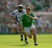 10 June 2001; Barry Foley of Limerick in action against James Murray of Waterford during the Guinness Munster Senior Hurling Championship Semi-Final match between Limerick and Waterford at Páirc Uí Chaoimh in Cork. Photo by Brendan Moran/Sportsfile