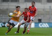 23 April 2016; Kevin O'Boyle, Antrim, in action against Conal McKeever, Louth, supported by team-mate James Califf, behind. Allianz Football League, Division 4, Final, Louth v Antrim. Croke Park, Dublin. Picture credit: Piaras Ó Mídheach / SPORTSFILE
