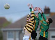 4 May 2010; Aodhán Clabby, St Benildus College, punches the ball away from team-mate Karl McGrath, right, and Sean Mac Cratih, Colaiste Eoin. Dublin School Senior Football A Final, St Benildus College v Colaiste Eoin, O'Toole Park, Crumlin, Dublin. Picture credit: Dáire Brennan / SPORTSFILE