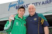 4 May 2010; Ireland's Ryan Burnett, Holy Family Club, and Coach Gerry Storey at Belfast City Airport as the Irish Boxing team arrive back from AIBA World Youth Championships in Azerbaijan. Joe Ward won the gold medal in the middleweight contest and Ryan Burnett earned a silver medal in the light flyweight contest. Belfast City Airport, Belfast. Picture credit: Michael Cullen / SPORTSFILE