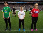 24 April 2016; Cahal McCabe, centre, Co. Tyrone, alongside, Paul O'Brien, Co. Meath, and Laura Whelan, Co. Cork, reading a line of the Proclamation during the Laochra entertainment performance after the Allianz Football League Final. Allianz Football League Finals, Croke Park, Dublin.  Picture credit: Brendan Moran / SPORTSFILE