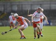 15 May 2010; Conor Grogan, Tyrone, in action against Nathan Curry and Cathal Carvill, Armagh. Ulster GAA Hurling Senior Championship Second Round, Armagh v Tyrone, Casement Park, Belfast. Picture credit: Oliver McVeigh / SPORTSFILE