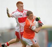 16 May 2010; Niall McConville, Armagh, in action against Christopher Spiers, Derry. ESB Ulster GAA Football Minor Championship, Derry v Armagh, Celtic Park, Derry. Photo by Sportsfile