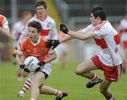 16 May 2010; Colin Stevenson, Armagh, in action against Karl McCaigue, Derry. ESB Ulster GAA Football Minor Championship, Derry v Armagh, Celtic Park, Derry. Picture credit: Oliver McVeigh / SPORTSFILE