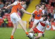 16 May 2010; Conor Gough, Armagh, has his shot blocked by Nathan Rocks, Derry. ESB Ulster GAA Football Minor Championship, Derry v Armagh, Celtic Park, Derry. Picture credit: Oliver McVeigh / SPORTSFILE