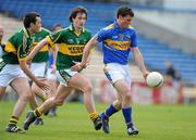 16 May 2010; Tony Egan, Tipperary, in action against Don Murphy, centre, and Brian McGuire, Kerry. Munster GAA Football Junior Championship Quarter-Final, Kerry v Tipperary, Semple Stadium, Thurles, Co. Tipperary. Picture credit: Brendan Moran / SPORTSFILE