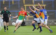 16 May 2010; Brendan Murphy, Carlow, in action against Tony Hannon and Paul Earls, Wicklow. Leinster GAA Football Senior Championship Preliminary Round, Wicklow v Carlow, O'Moore Park, Portlaoise, Co. Laoise. Picture credit: Matt Browne / SPORTSFILE