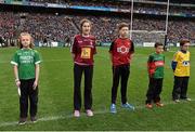 24 April 2016; Blathnaid Daly, 2nd from left, Co. Westmeath, reading a line of the Proclamation during the Laochra entertainment performance after the Allianz Football League Final. Allianz Football League Finals, Croke Park, Dublin.  Picture credit: Brendan Moran / SPORTSFILE