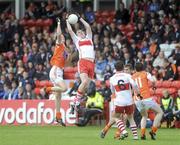 16 May 2010; Ryan Bell, Derry, wins a high ball against Conor Gough, Armagh. ESB Ulster GAA Football Minor Championship, Derry v Armagh, Celtic Park, Derry. Picture credit: Oliver McVeigh / SPORTSFILE