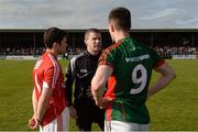 30 April 2016; Referee Padraig Hughes speaks with team captains Stephen Cronin, Cork, left, and Stephen Coen, Mayo. EirGrid GAA Football Under 21 All-Ireland Championship Final, Cork v Mayo. Cusack Park, Ennis, Co. Clare. Picture credit: Piaras Ó Mídheach / SPORTSFILE