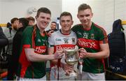 30 April 2016; Mayo players, from left, Eoin O'Donoghue, Scott Kilker and James Kelly celebrate with the cup after the game. EirGrid GAA Football Under 21 All-Ireland Championship Final, Cork v Mayo. Cusack Park, Ennis, Co. Clare. Picture credit: Piaras Ó Mídheach / SPORTSFILE