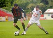 6 June 2010; Killian Brennan, Bohemians, in action against David Keogh, Glenville. FAI Ford Cup Third Round, Glenville v Bohemians, Richmond Park, Inchicore, Dublin. Picture credit: Barry Cregg / SPORTSFILE