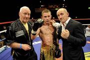 11 June 2010; Carl Frampton, centre, along with Gerry Stoey, left, trainer, and Barry McGuigan manager, after victory over Ian Bailey in their Super Bantamweight fight. Yanjing Beer Fight Night, King's Hall, Belfast. Picture credit: Oliver McVeigh / SPORTSFILE